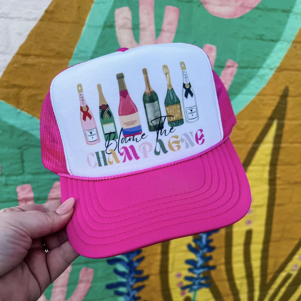BLAME THE CHAMPAGNE TRUCKER HAT IN PINK-Hats-MODE-Couture-Boutique-Womens-Clothing
