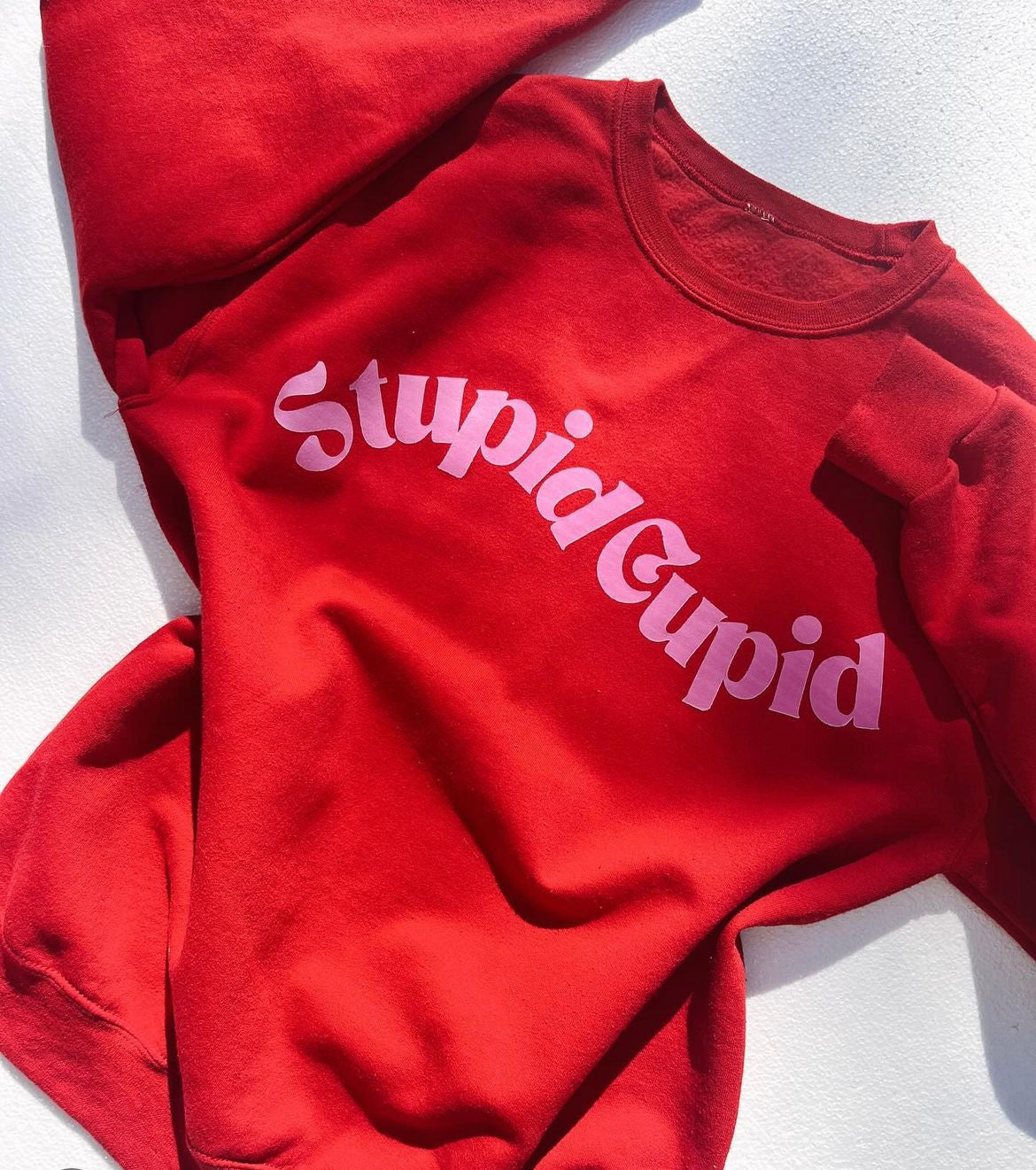 STUPID CUPID GRAPHIC SWEATSHIRT IN RED-Graphic Sweatshirt-MODE-Couture-Boutique-Womens-Clothing