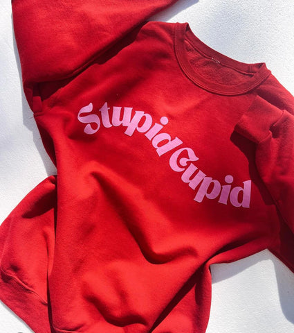 STUPID CUPID GRAPHIC SWEATSHIRT IN RED-Graphic Sweatshirt-MODE-Couture-Boutique-Womens-Clothing