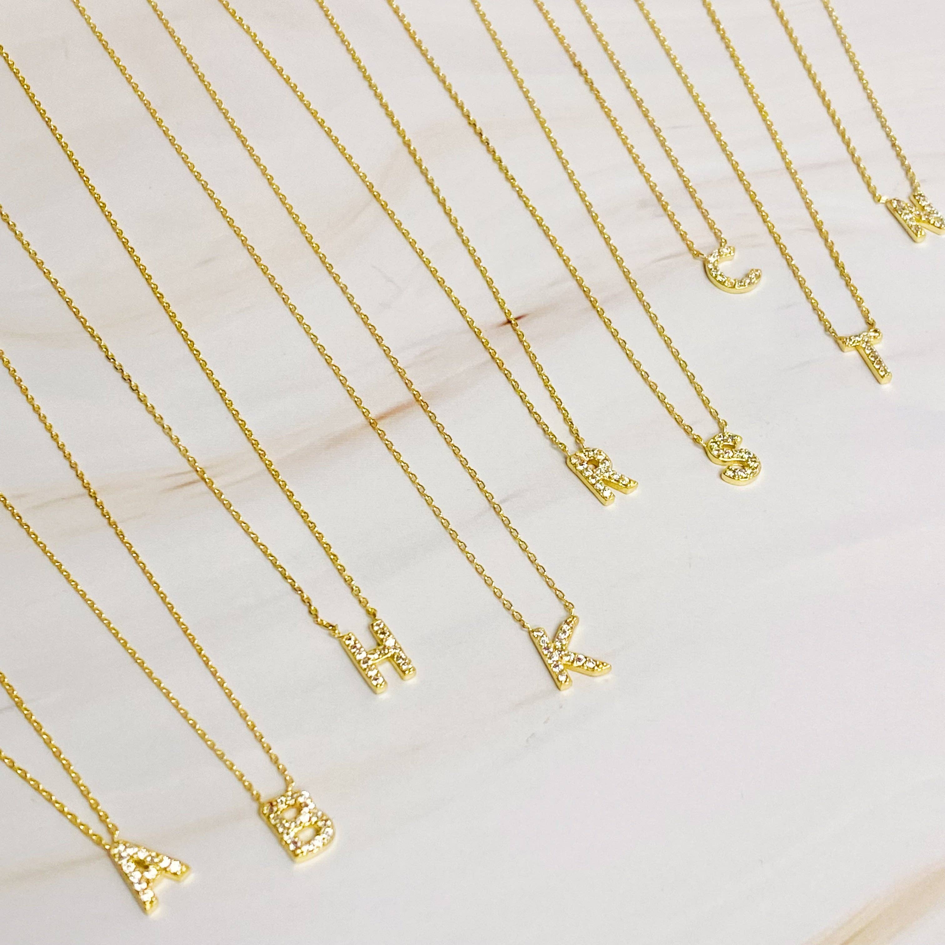 UNDERSTATED BEAUTY INITIAL NECKLACE IN GOLD-NECKLACE-MODE-Couture-Boutique-Womens-Clothing