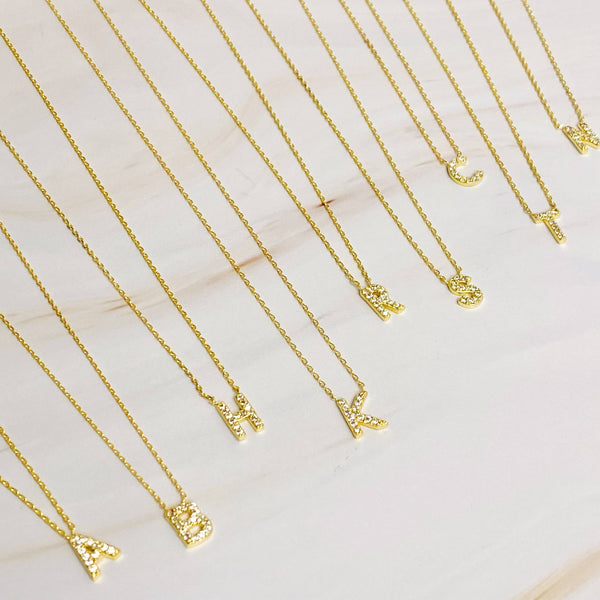 UNDERSTATED BEAUTY INITIAL NECKLACE IN GOLD-NECKLACE-MODE-Couture-Boutique-Womens-Clothing