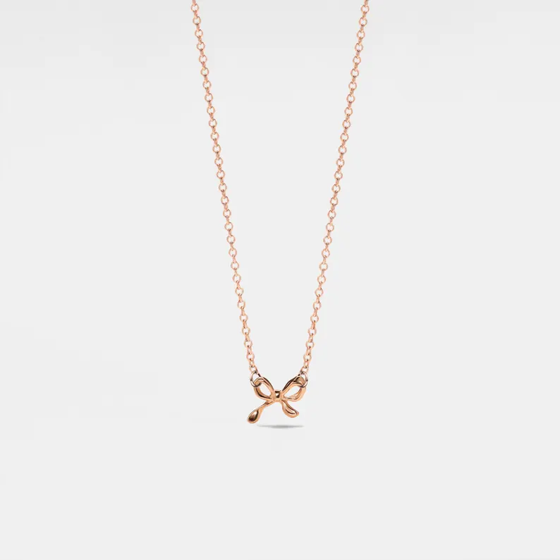 TINY SMALL BOW RIBBON NECKLACE IN GOLD-NECKLACE-MODE-Couture-Boutique-Womens-Clothing