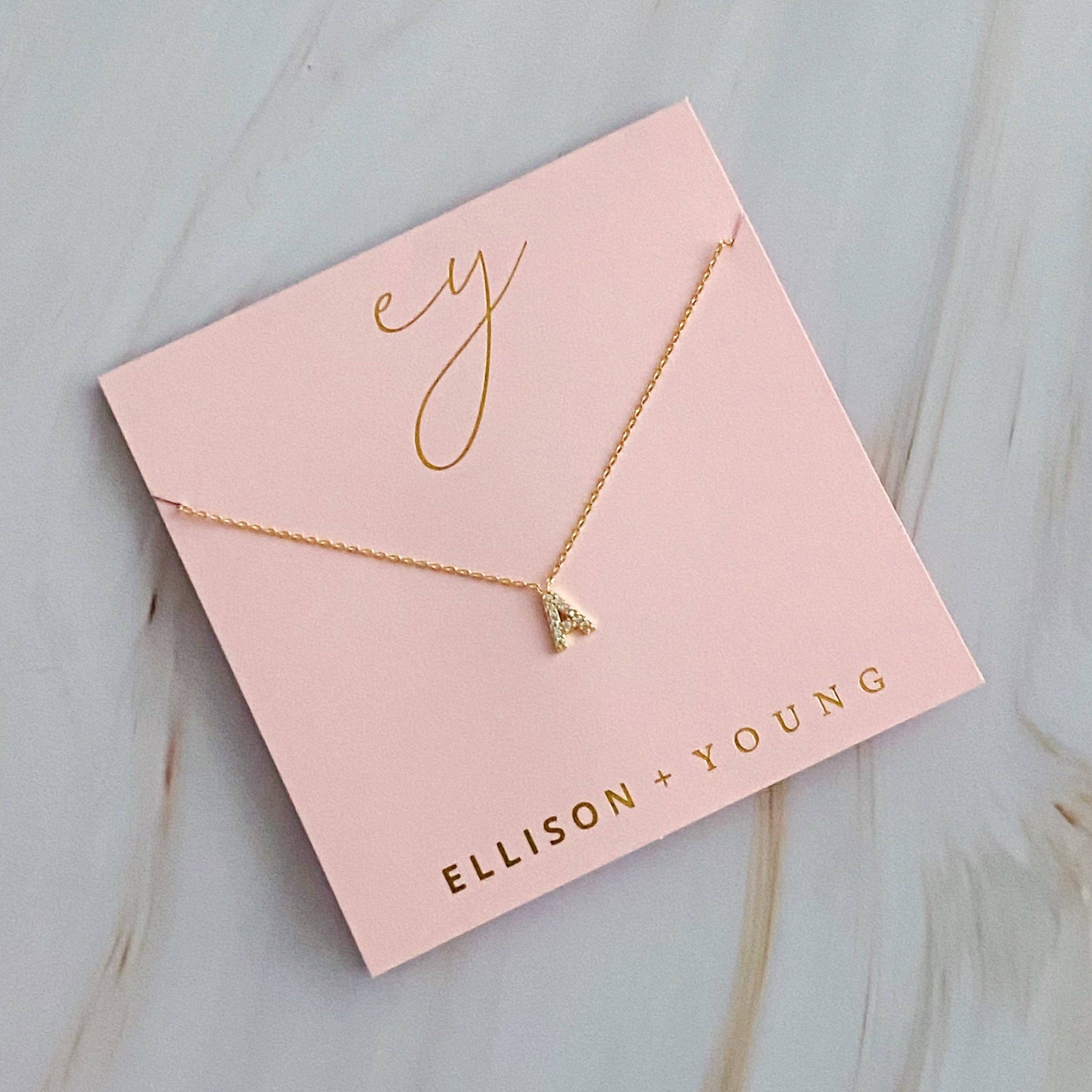 UNDERSTATED BEAUTY INITIAL NECKLACE IN GOLD-NECKLACE-MODE-Couture-Boutique-Womens-Clothing
