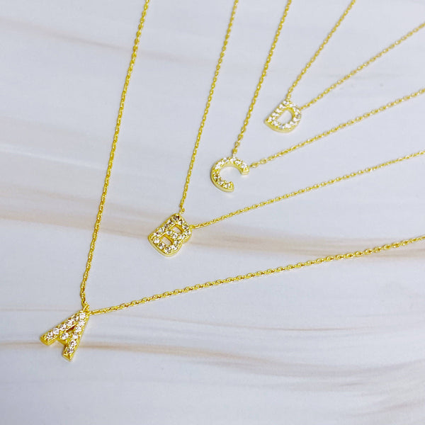 UNDERSTATED BEAUTY INITIAL NECKLACE IN GOLD-NECKLACE-MODE-Couture-Boutique-Womens-Clothing